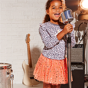 Girl singing into a microphone